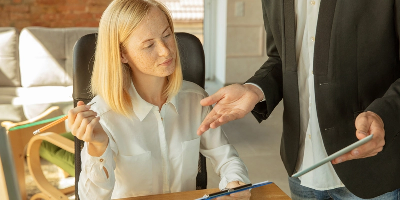 Conveyancing solicitor discussing with clients